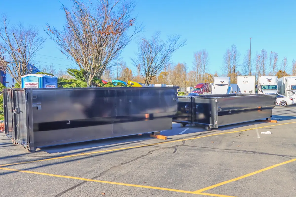 Professional dumpster rental service with roll-off container on residential driveway in La Cresta